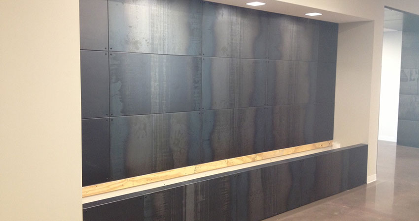 An image of a feature wall in a corporate office with a custom design
