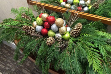 An image of a pot filled with holiday decor