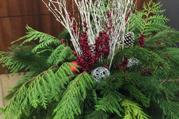 An image of a pot filled with holiday decor