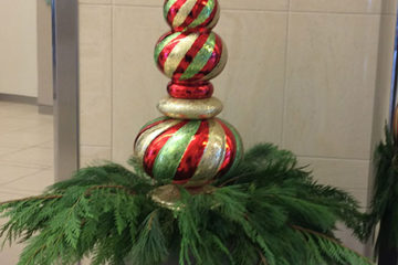 An image of a pot filled with holiday decor