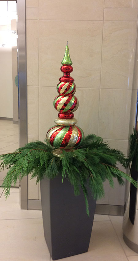 An image of a pot filled with holiday decor
