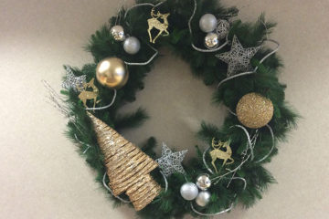 An image of a hanging Christmas wreath