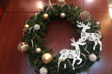 An image of a hanging Christmas wreath